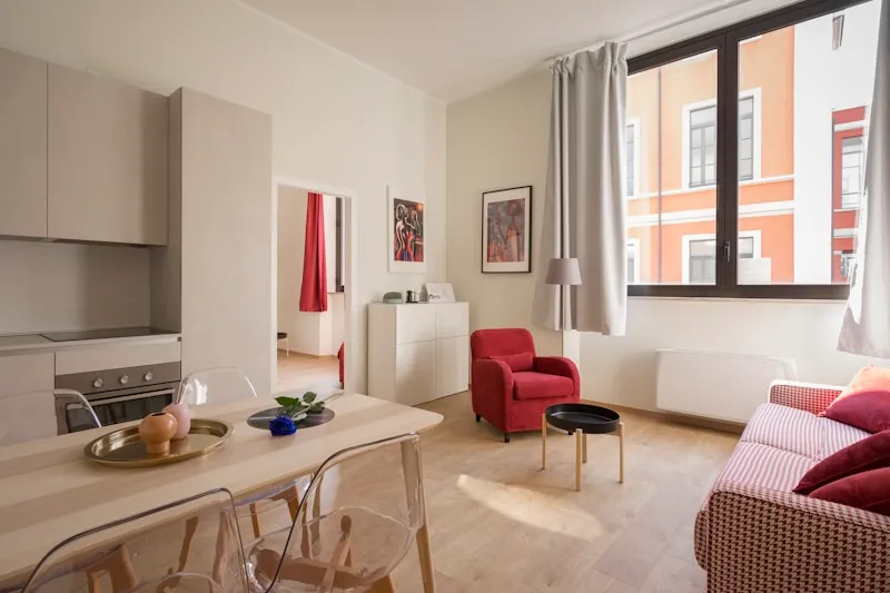 Minimalist studio apartment in Grünerløkka Oslo with open layout and light neutral palette, staged for sale — MT Home